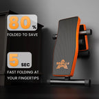 Orange and black fitness bench with folding feature text on a dark background