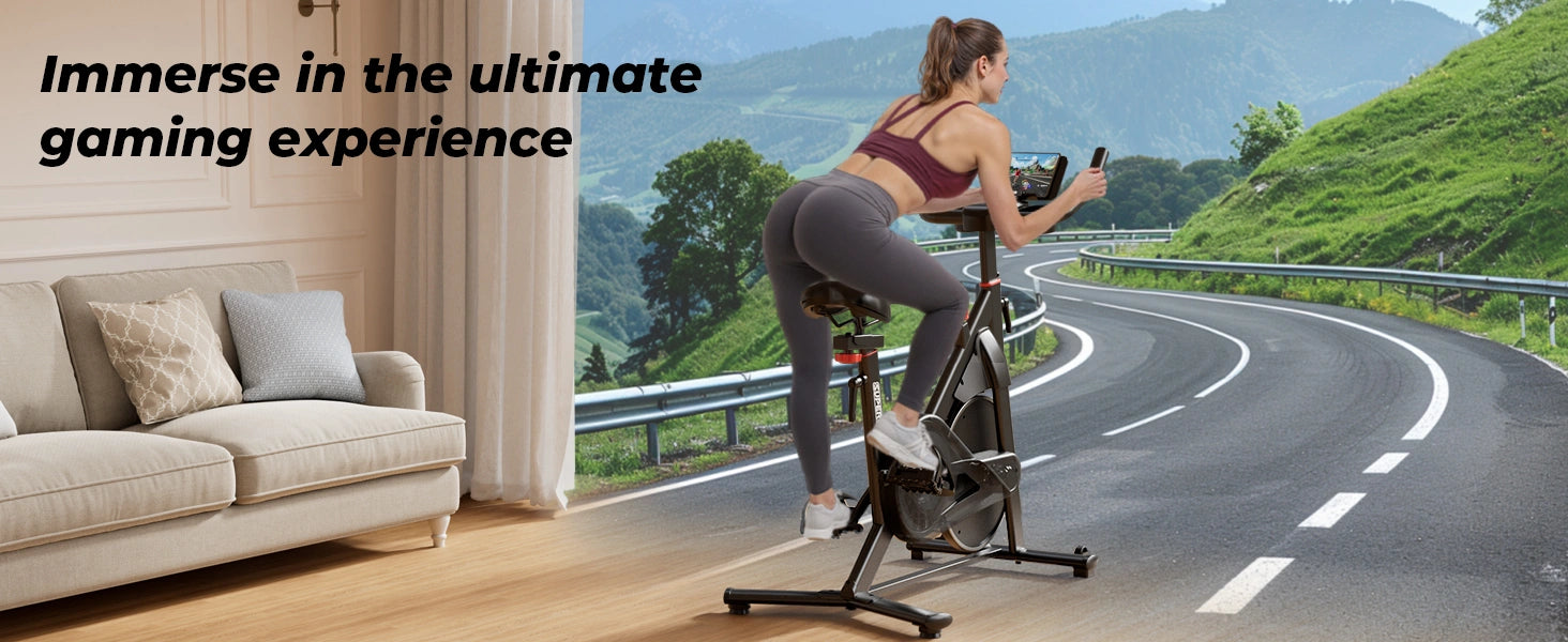 Woman exercising on a stationary bike with a scenic view and indoor living room setting.
