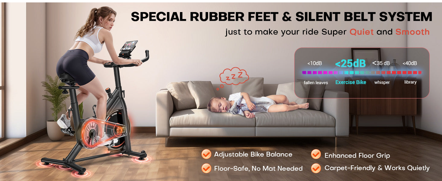 Woman exercising on a stationary bike with a baby sleeping on a couch, emphasizing quietness and comfort.