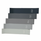 Set of 5 black, gray, and white resistance bands on a white background